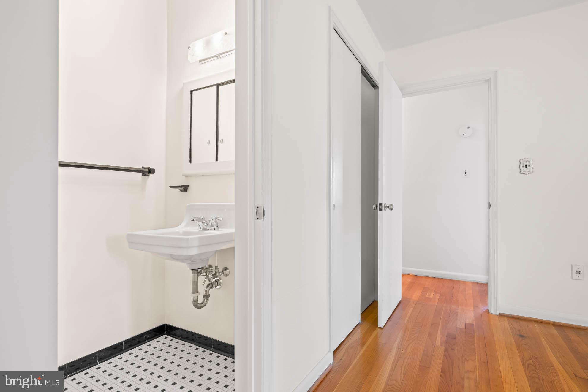 210 Rothwell Drive Lutherville-Timonium, MD 21093 - Photo 21 of 48 a bathroom with a sink and a mirror