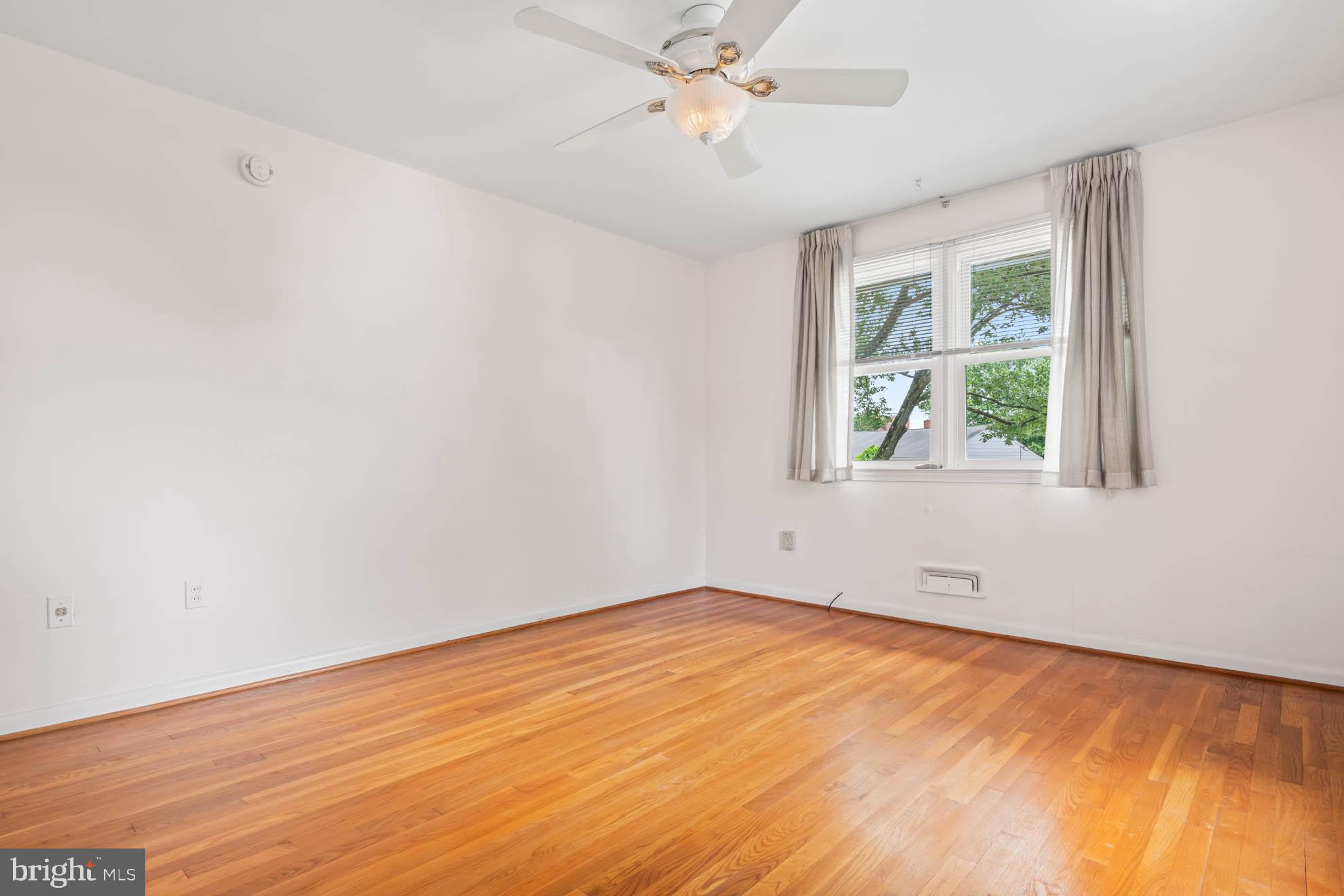 210 Rothwell Drive Lutherville-Timonium, MD 21093 - Photo 26 of 48 an empty room with a window and a ceiling fan