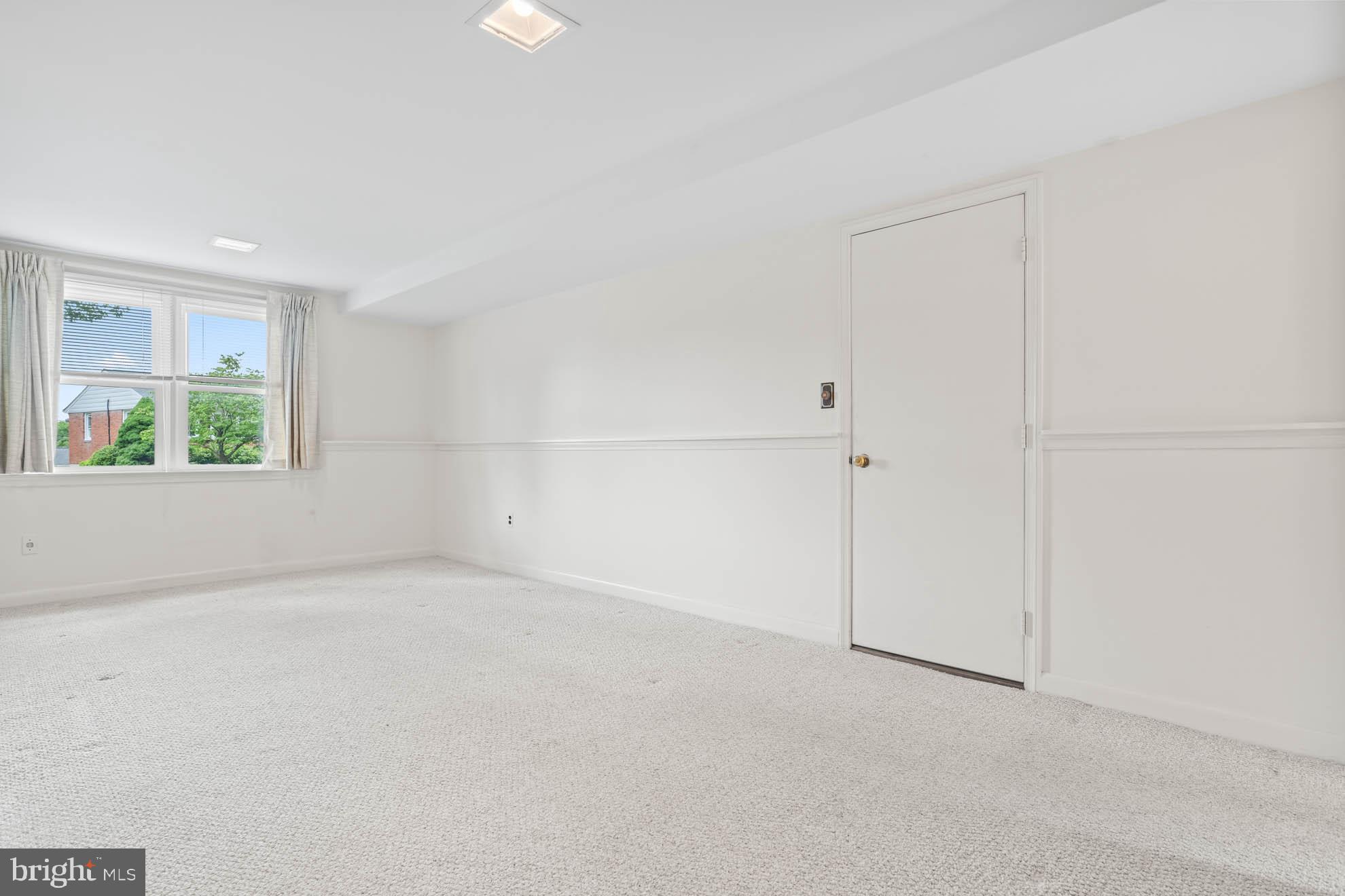 210 Rothwell Drive Lutherville-Timonium, MD 21093 - Photo 32 of 48 an empty room with windows