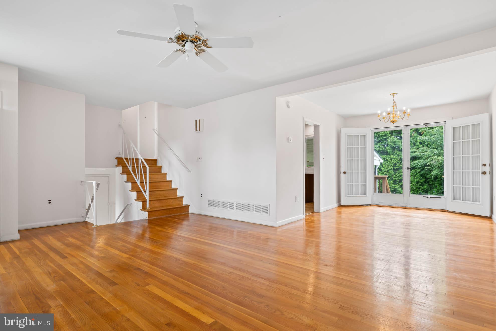 210 Rothwell Drive Lutherville-Timonium, MD 21093 - Photo 8 of 48 a view of empty room with wooden floor and fan