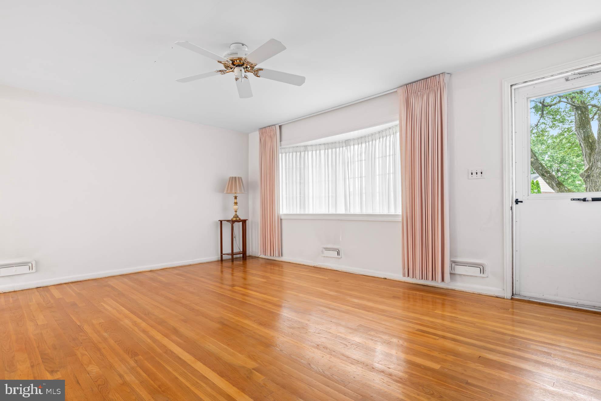 210 Rothwell Drive Lutherville-Timonium, MD 21093 - Photo 10 of 48 wooden floor in an empty room with a window