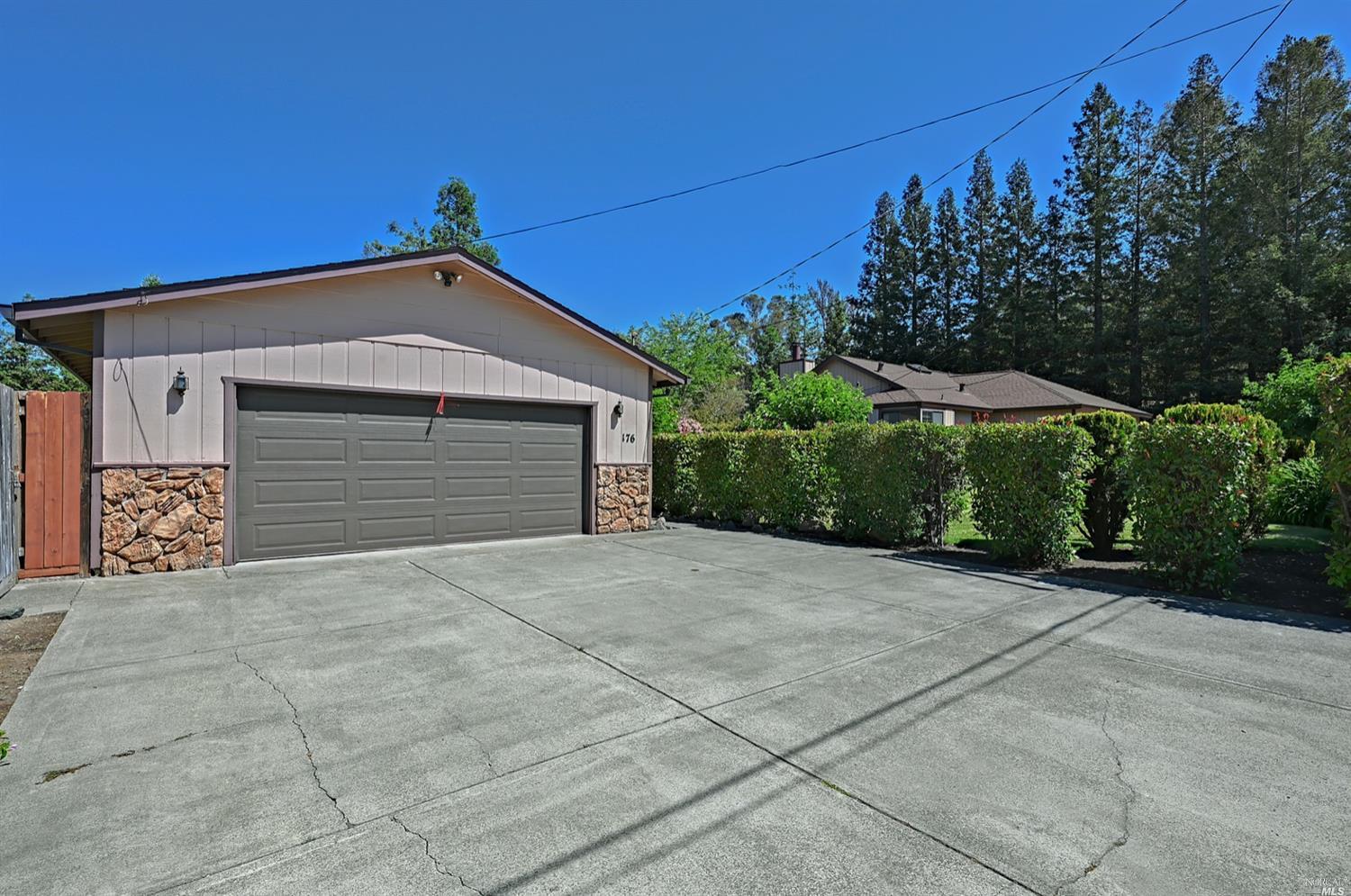 176-378 Brey Road Santa Rosa, CA 95409 - Photo 1 of 1 a front view of a house with a yard and garage