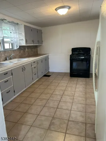 a kitchen with a cabinets and window