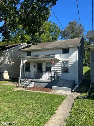 a view of a patio with table and chairs a barbeque with potted plants