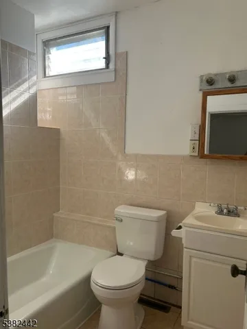 a bathroom with a sink toilet and bathtub