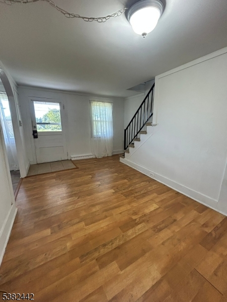 100 Myrtle Avenue Washington, NJ 07882 - Photo 5 of 37 a view of empty room with wooden floor and fan