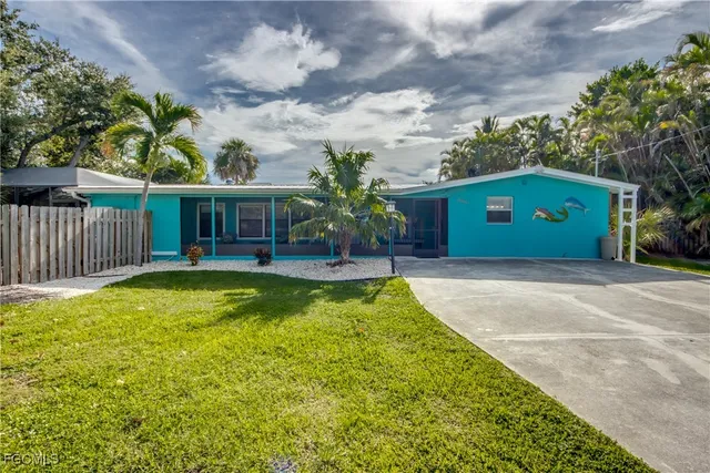 a house view with swimming pool in front of it