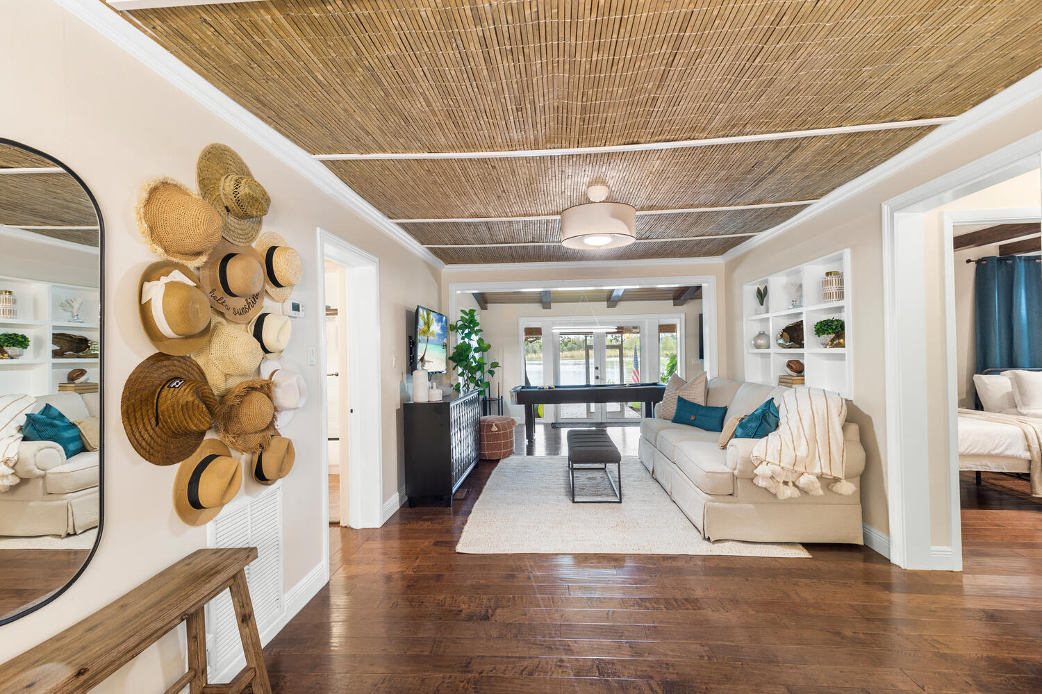 303 Lang Road Cloud Lake, FL 33406 - Photo 13 of 38 a view of a dining room with furniture and wooden floor