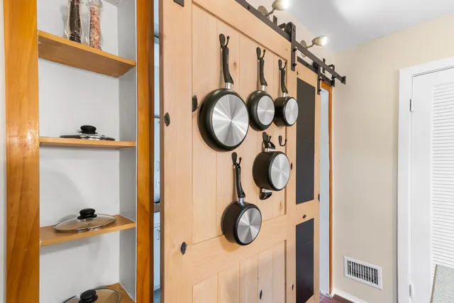 a bathroom with a shower and mirror