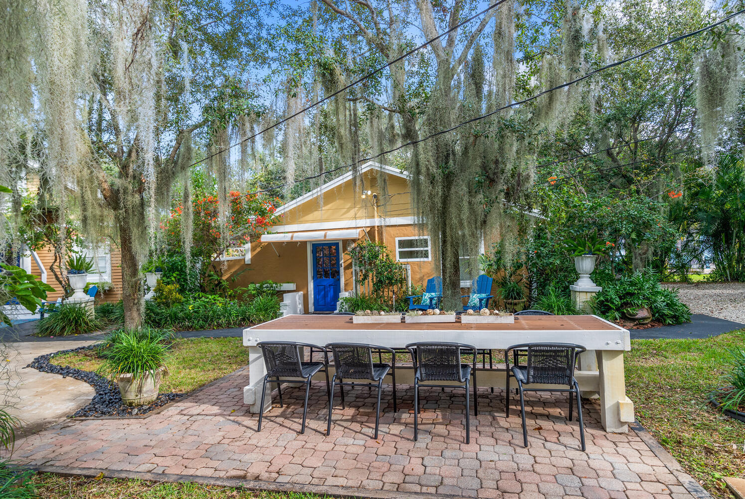 303 Lang Road Cloud Lake, FL 33406 - Photo 22 of 38 a view of a table and chairs in patio