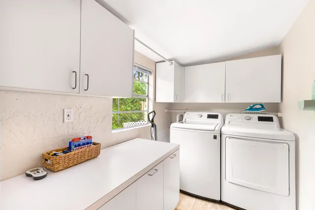 a utility room with dryer and washer