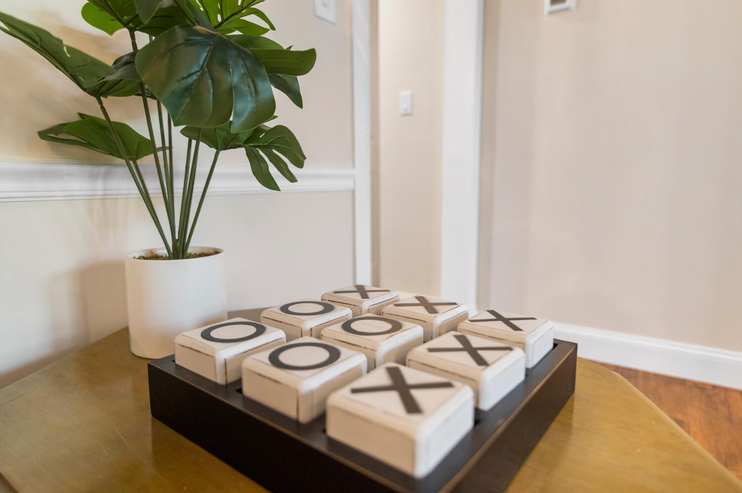 303 Lang Road Cloud Lake, FL 33406 - Photo 32 of 38 a close view of dining table with chairs and a potted plant