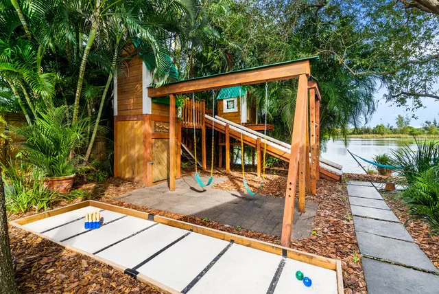 a view of swimming pool with a patio