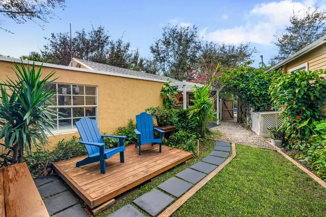 a view of a backyard with sitting area