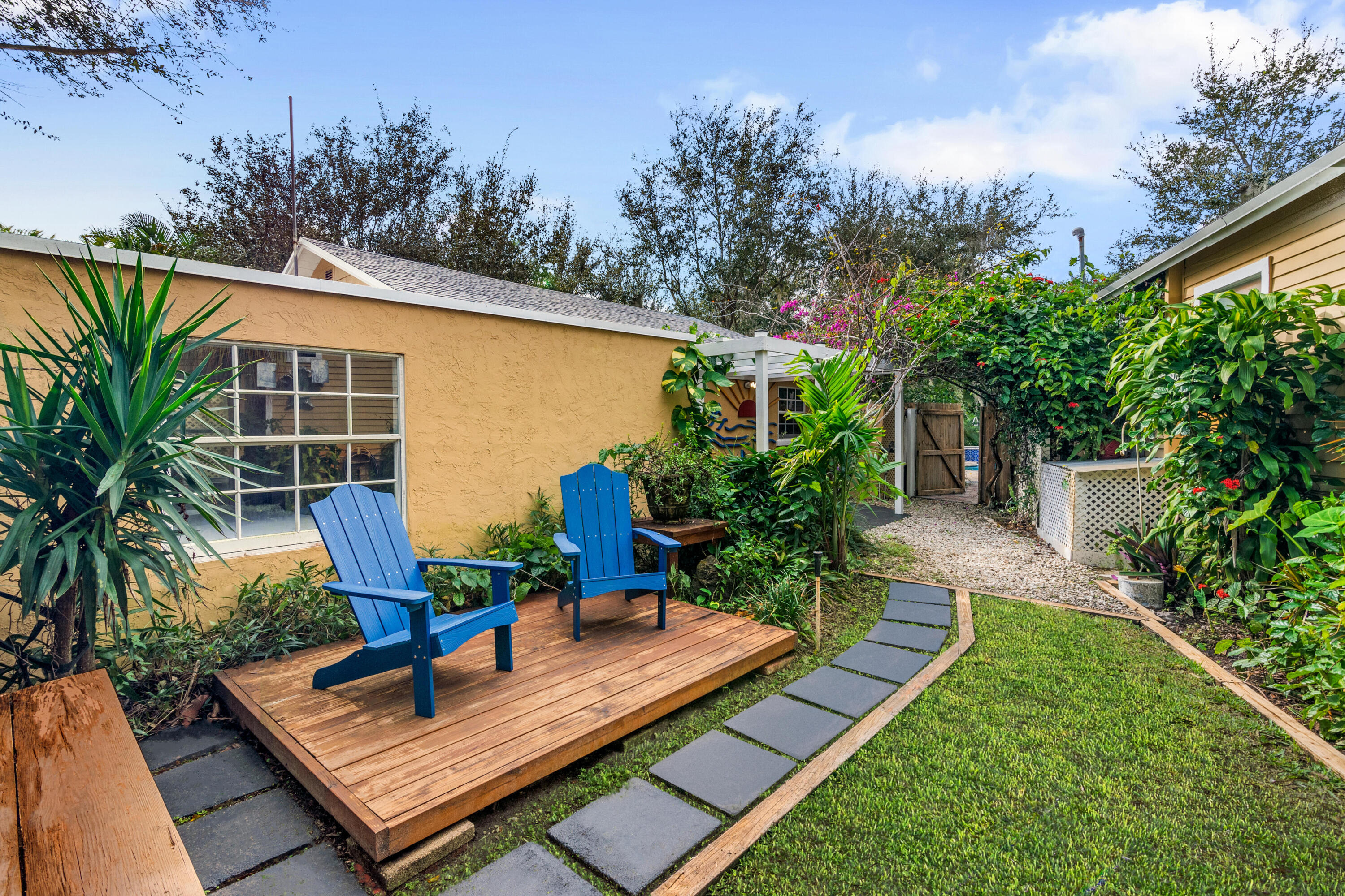 303 Lang Road Cloud Lake, FL 33406 - Photo 7 of 38 a view of a backyard with sitting area