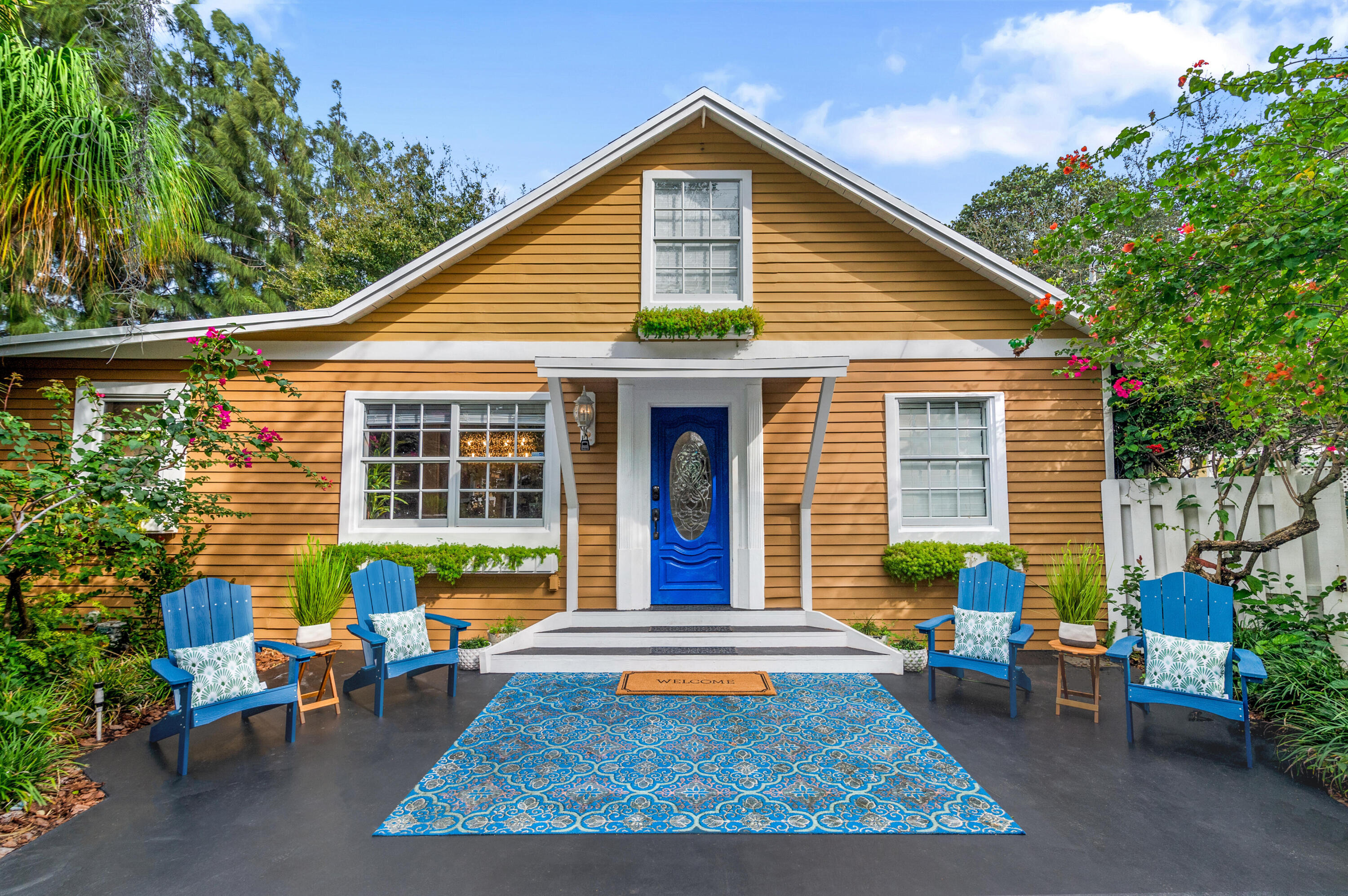 303 Lang Road Cloud Lake, FL 33406 - Photo 8 of 38 a view of a house with a chairs in patio