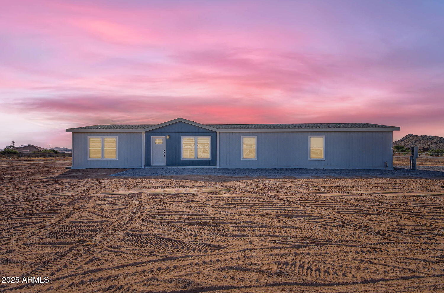 0 North Hidden Valley Road, Unit B Maricopa, AZ 85139 - Photo 3 of 4 a view of a house with a yard