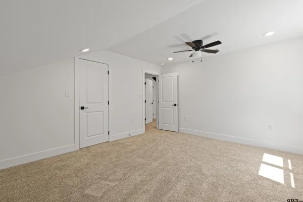 a view of a backyard with large trees