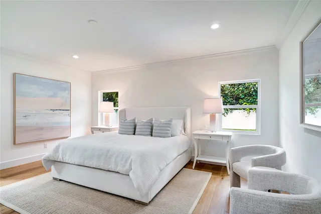 a bedroom with a bed and a couch