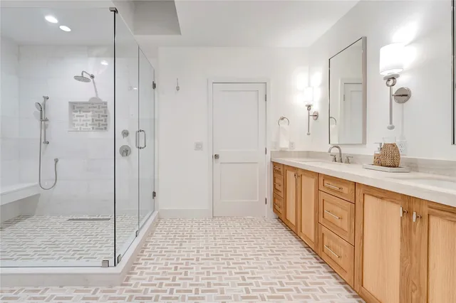 a spacious bathroom with a shower and a sink