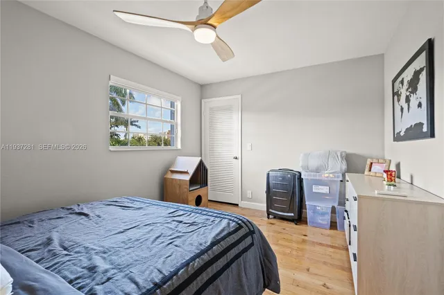 a view of a patio with table and chairs potted plants with wooden floor
