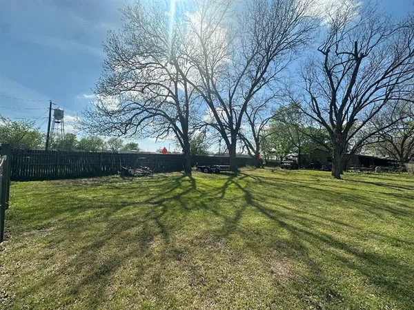 a view of an outdoor space and basketball court