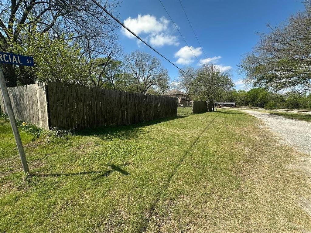 302 North Commercial Street Bells, TX 75414 - Photo 6 of 6 a view of an outdoor space and basketball court