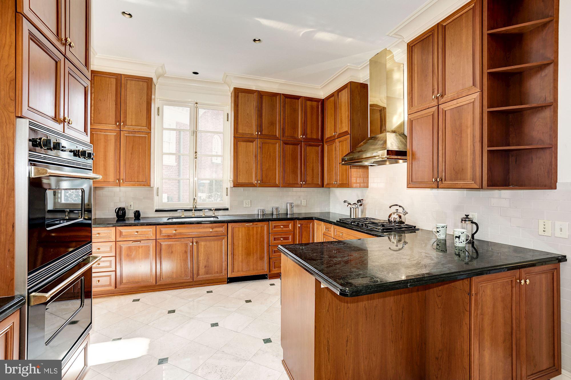 84 Kalorama Circle Northwest Washington, DC 20008 - Photo 15 of 45 a kitchen with stainless steel appliances granite countertop a sink stove and cabinets