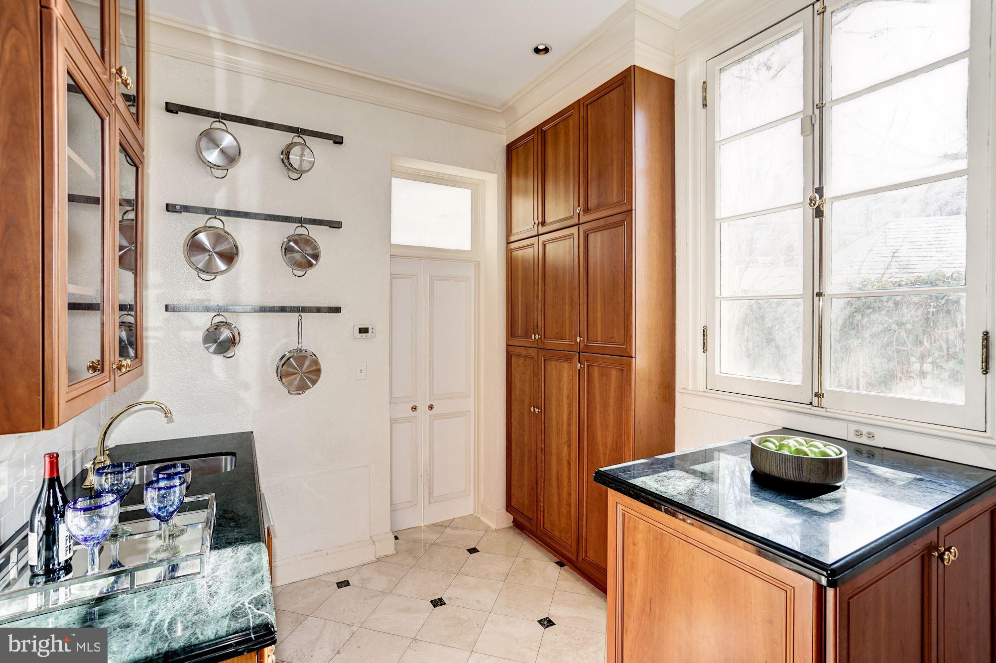 84 Kalorama Circle Northwest Washington, DC 20008 - Photo 17 of 45 a kitchen with stainless steel appliances granite countertop a sink stove and refrigerator