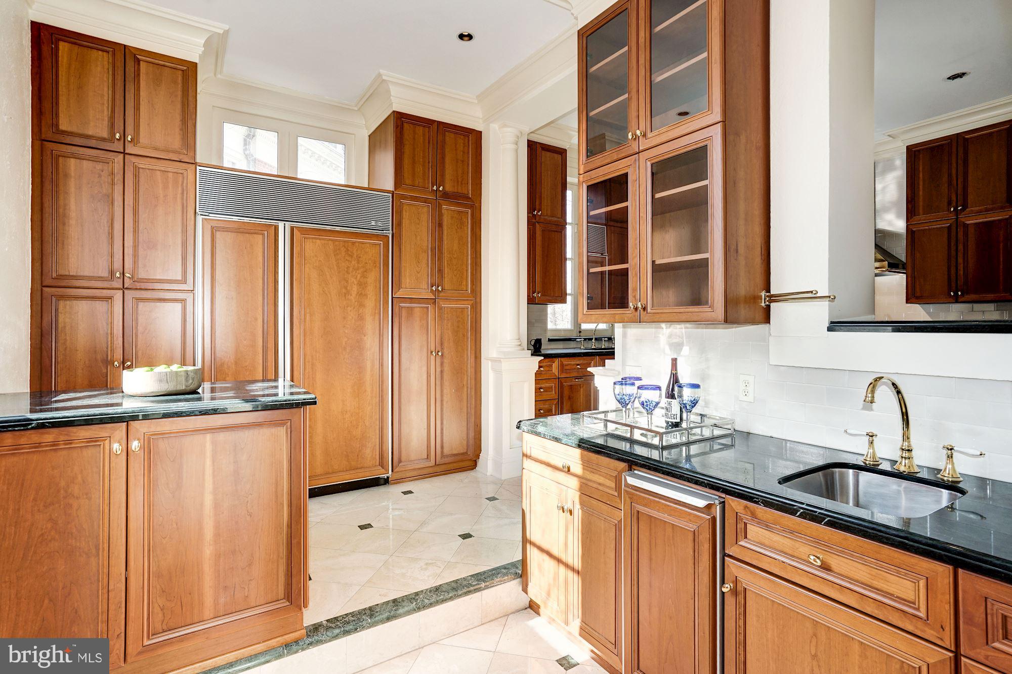 84 Kalorama Circle Northwest Washington, DC 20008 - Photo 18 of 45 a kitchen with stainless steel appliances a sink and cabinets