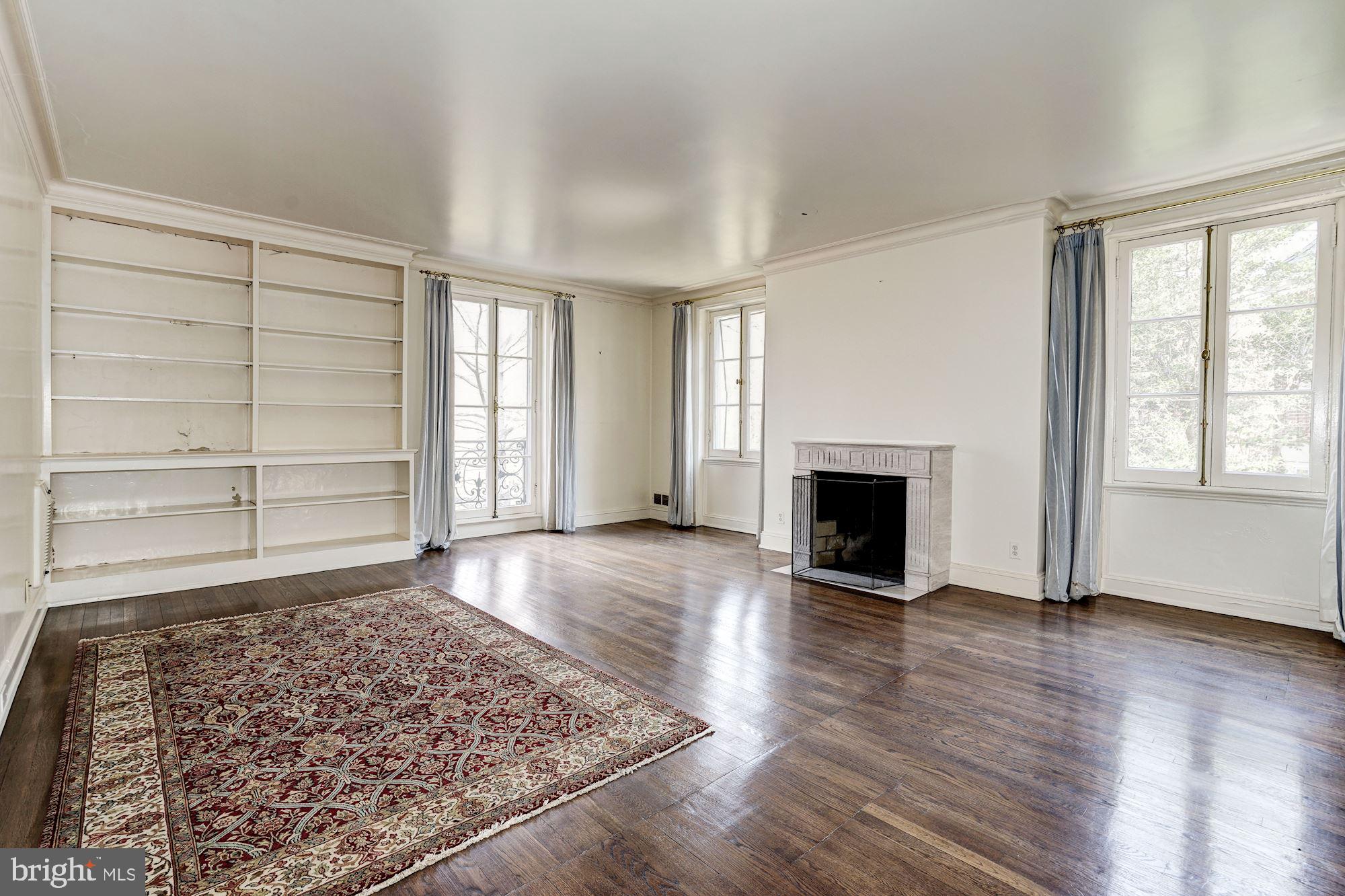 84 Kalorama Circle Northwest Washington, DC 20008 - Photo 20 of 45 an empty room with windows and fireplace