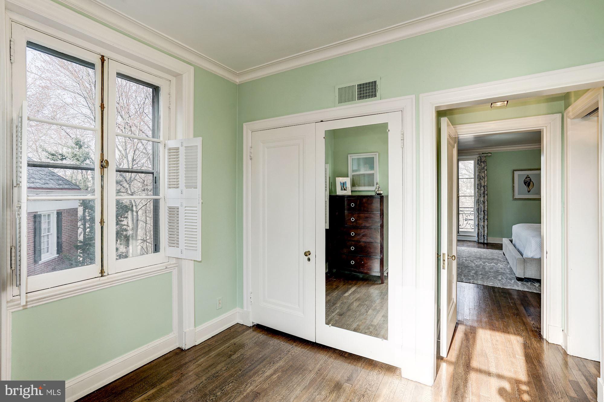 84 Kalorama Circle Northwest Washington, DC 20008 - Photo 28 of 45 a view of a bedroom with wooden floor and furniture