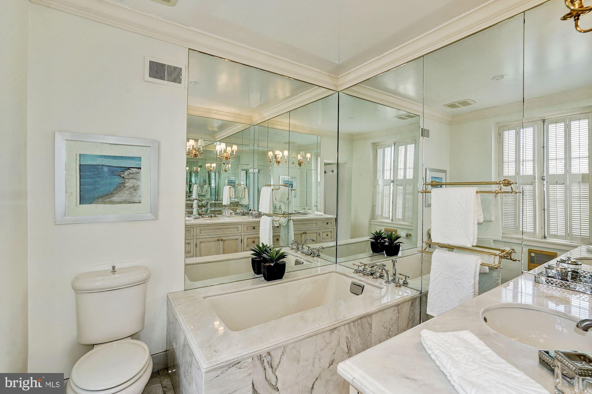 84 Kalorama Circle Northwest Washington, DC 20008 - Photo 30 of 45 a bathroom with a tub sink toilet and mirror