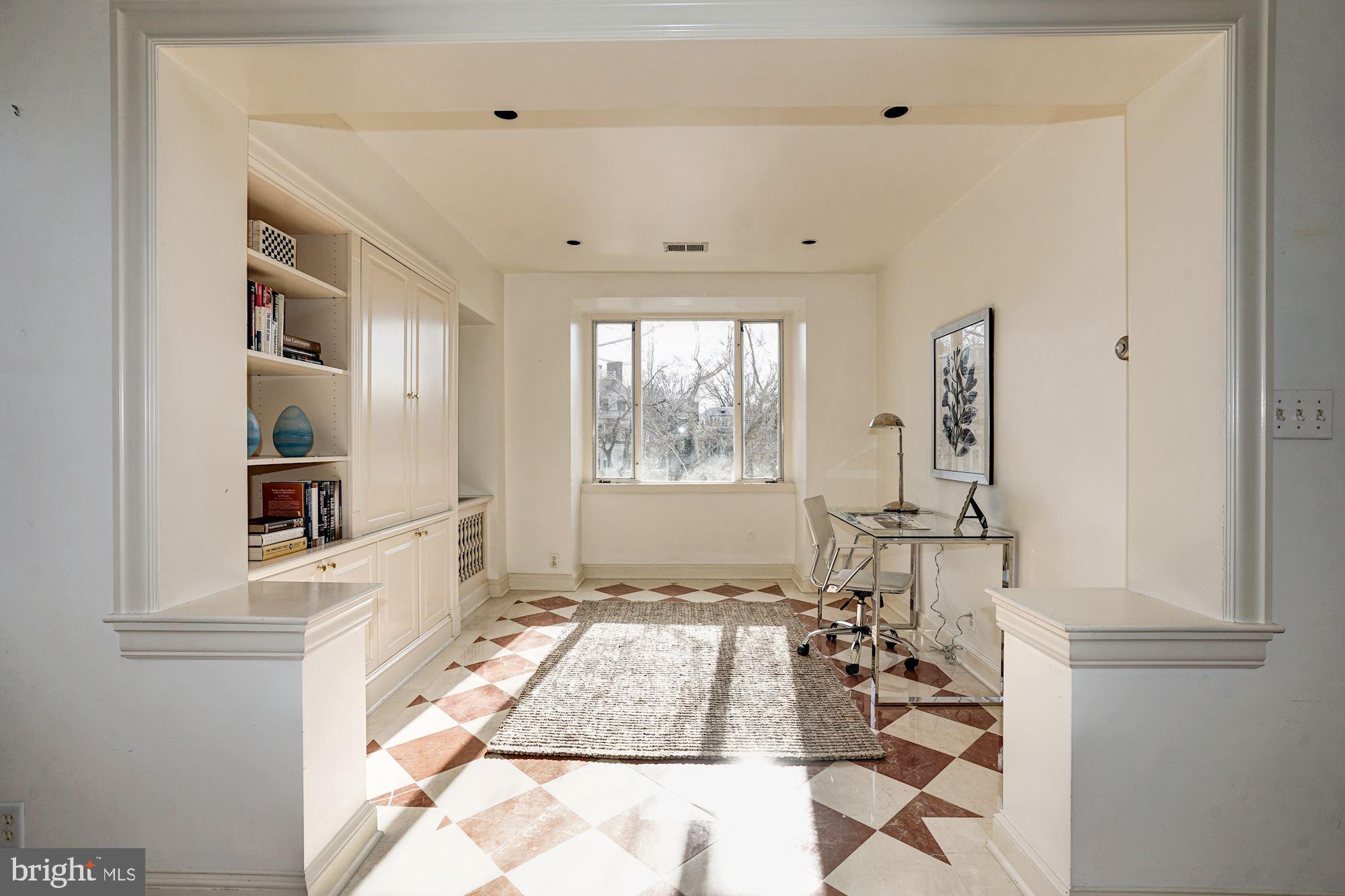 84 Kalorama Circle Northwest Washington, DC 20008 - Photo 33 of 45 a room with lots of white furniture and a window