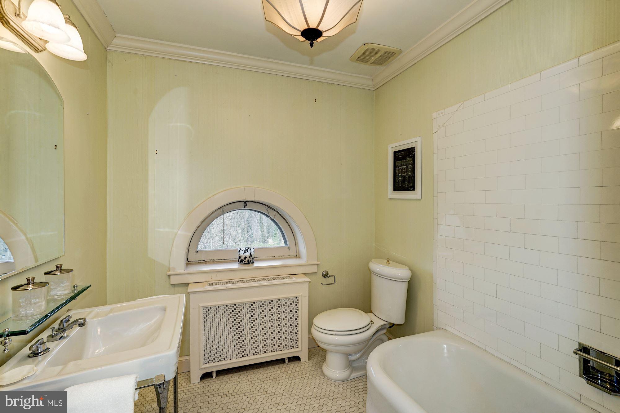84 Kalorama Circle Northwest Washington, DC 20008 - Photo 36 of 45 a bathroom with a toilet a sink and mirror