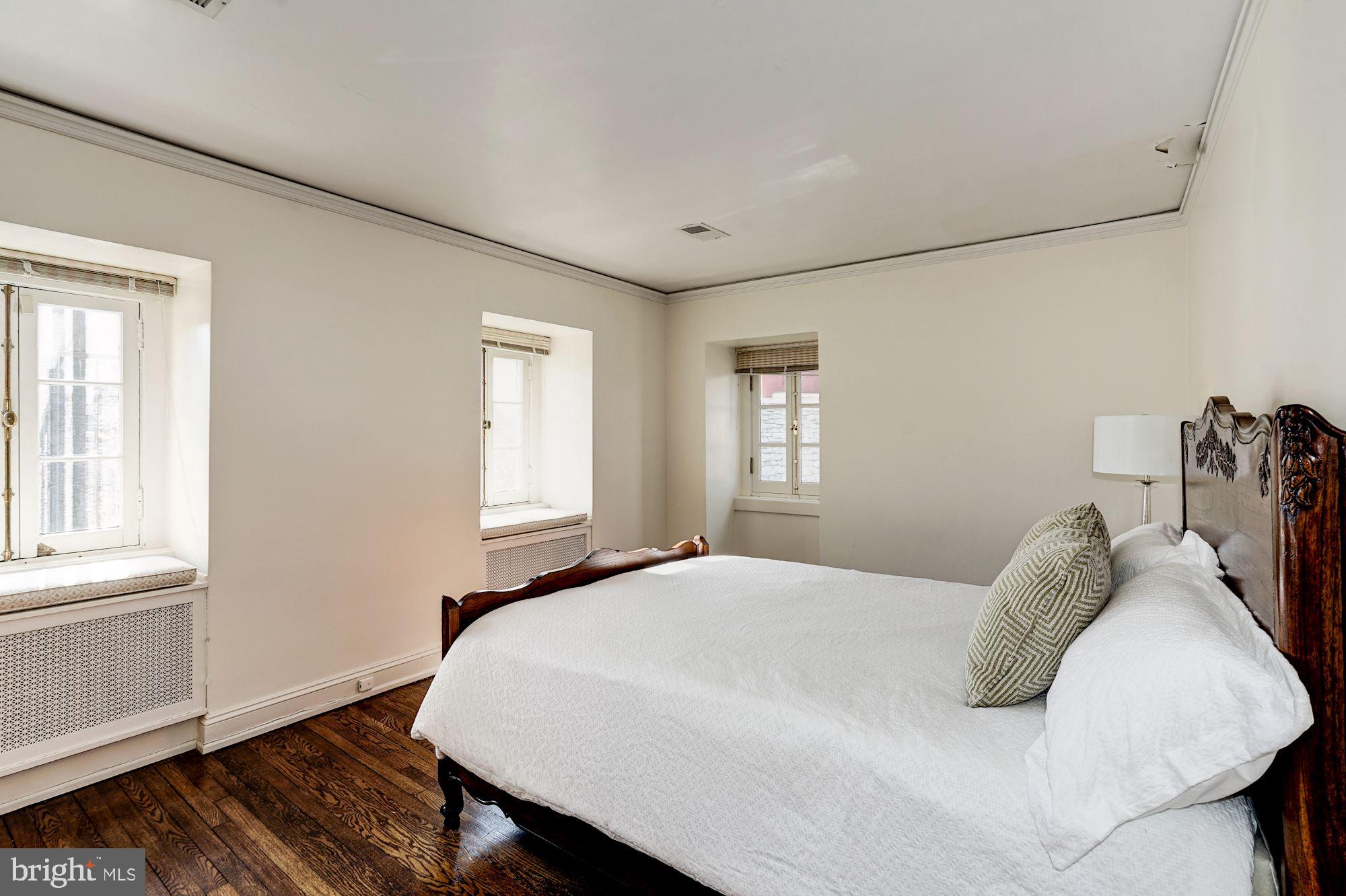 84 Kalorama Circle Northwest Washington, DC 20008 - Photo 37 of 45 a bedroom with a bed and wooden floor