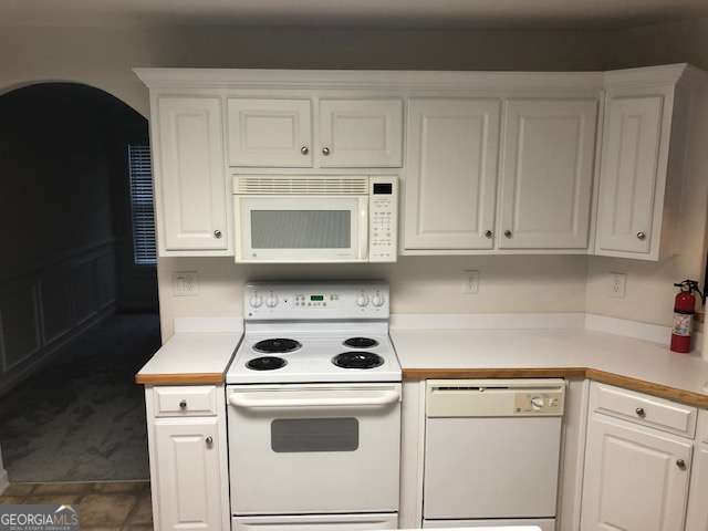225 Lexington Circle Athens, GA 30605 - Photo 15 of 23 a kitchen with white cabinets and white appliances
