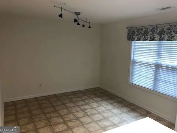 a view of a window in an empty room