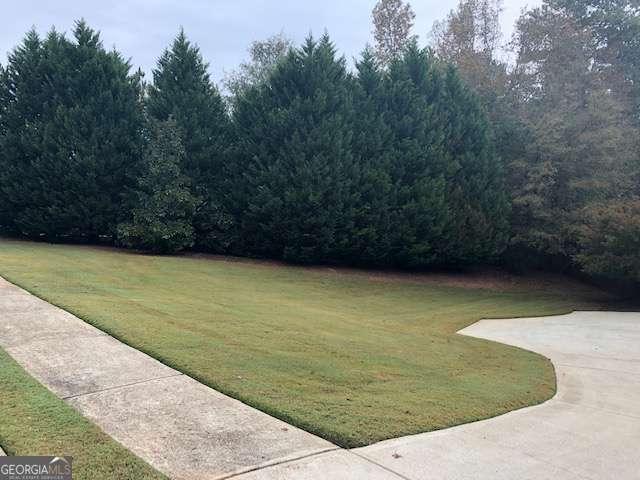 225 Lexington Circle Athens, GA 30605 - Photo 3 of 23 a view of a swimming pool with a yard