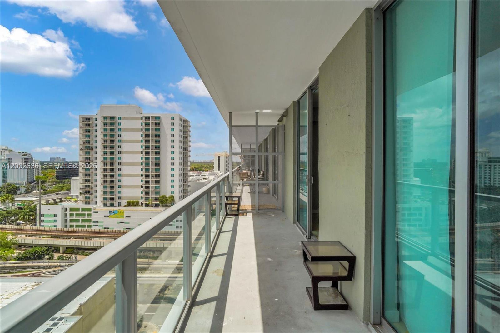 79 Southwest 12th Street, Unit 1605 Miami, FL 33130 - Photo 13 of 30 a view of swimming pool from a balcony