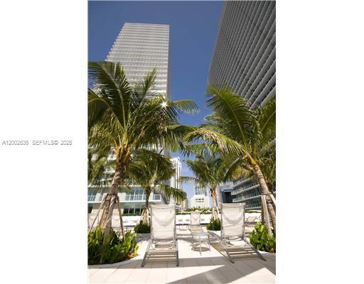 79 Southwest 12th Street, Unit 1605 Miami, FL 33130 - Photo 18 of 30 a picture of a night stand and potted plants
