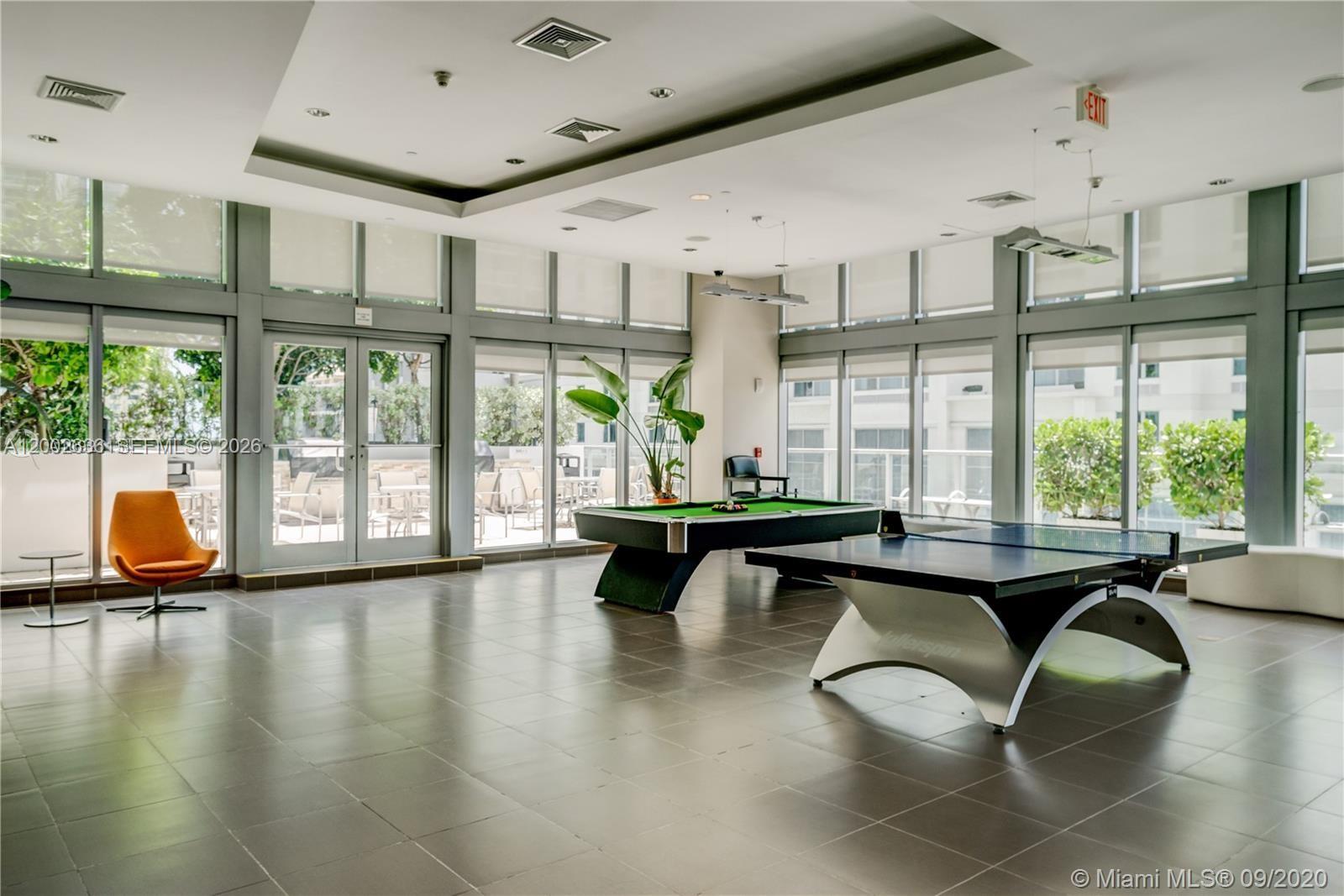 79 Southwest 12th Street, Unit 1605 Miami, FL 33130 - Photo 27 of 30 a living room with furniture and large windows