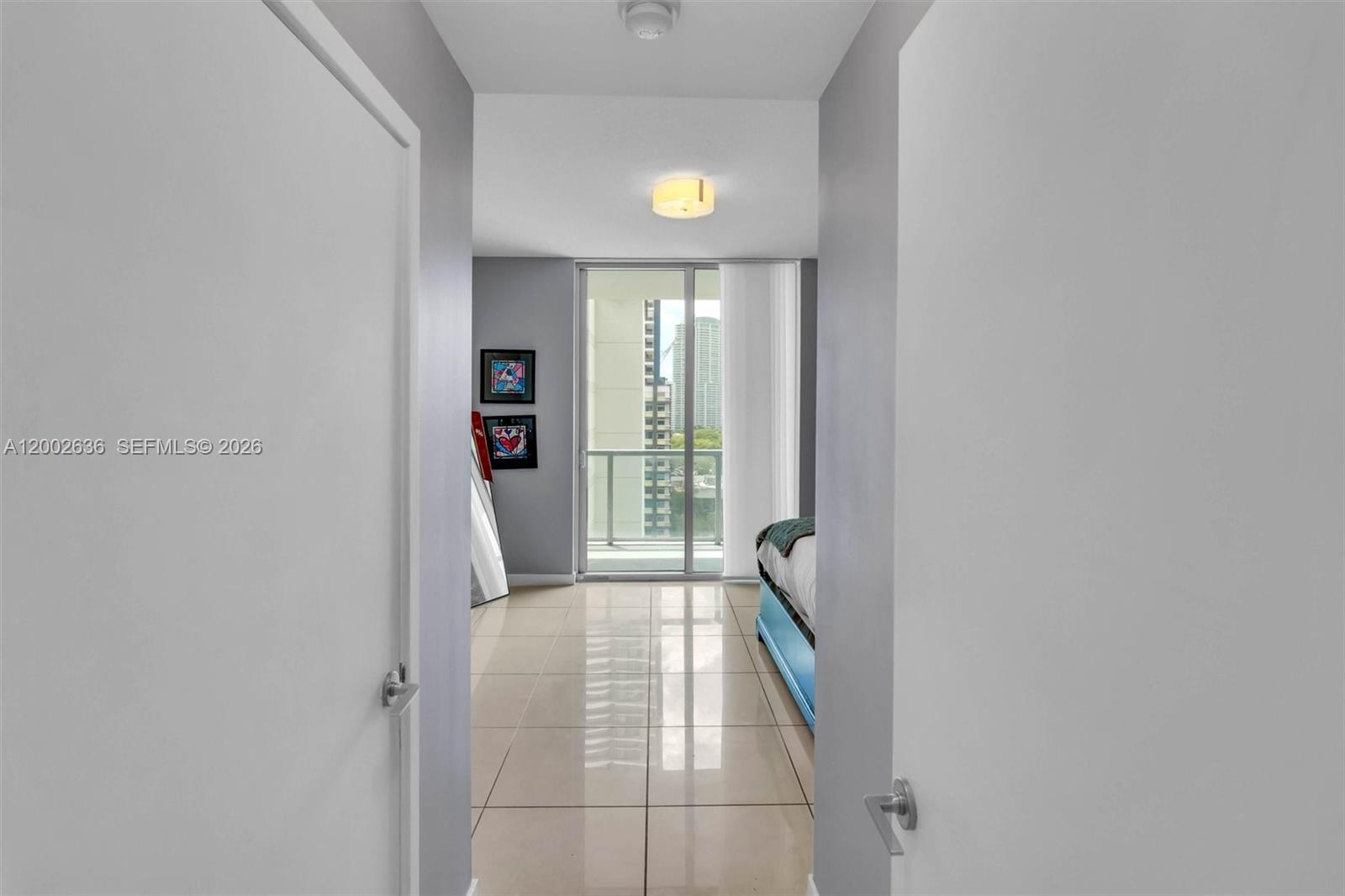 79 Southwest 12th Street, Unit 1605 Miami, FL 33130 - Photo 7 of 30 a view of hallway with furniture and a window
