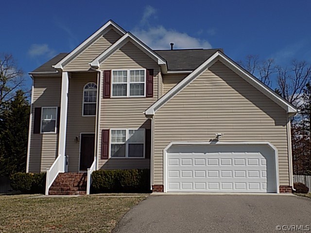 a front view of a house with a garage