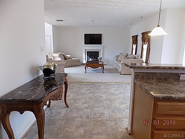 9324 Alcove Grove Road Chesterfield, VA 23832 - Photo 11 of 29 a living room with furniture a fireplace and a flat screen tv