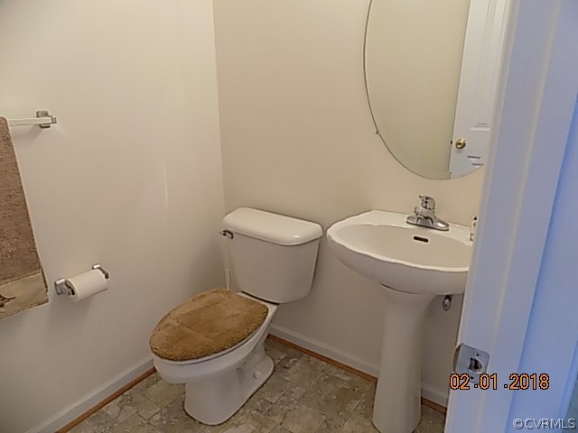 9324 Alcove Grove Road Chesterfield, VA 23832 - Photo 12 of 29 a bathroom with a toilet sink and mirror