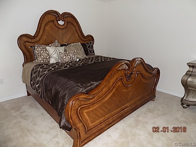9324 Alcove Grove Road Chesterfield, VA 23832 - Photo 14 of 29 a bed with a bed and a night stand