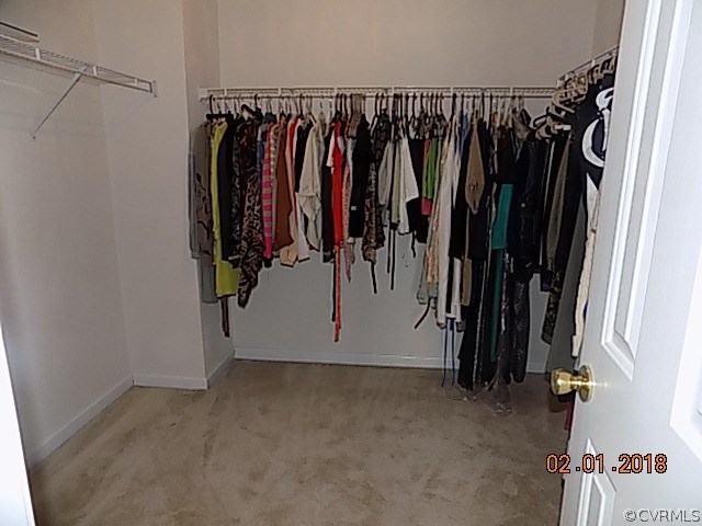9324 Alcove Grove Road Chesterfield, VA 23832 - Photo 19 of 29 a view of walk in closet with clothes