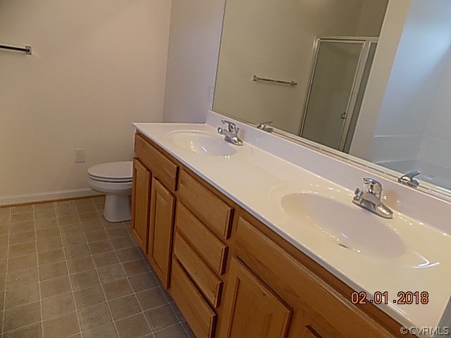 9324 Alcove Grove Road Chesterfield, VA 23832 - Photo 20 of 29 a bathroom with a sink and a toilet
