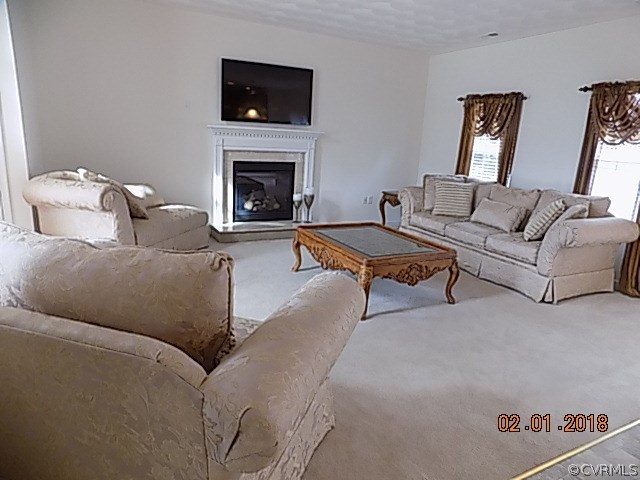 9324 Alcove Grove Road Chesterfield, VA 23832 - Photo 2 of 29 a living room with furniture and a fireplace